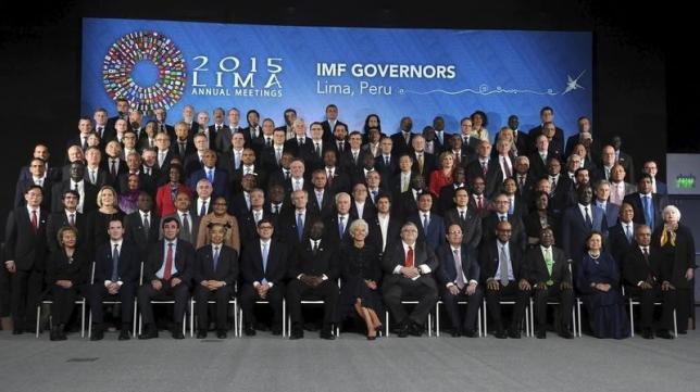 International Monetary Fund governors pose for a family photo during the 2015 IMF/World Bank Annual Meetings plenary session in Lima